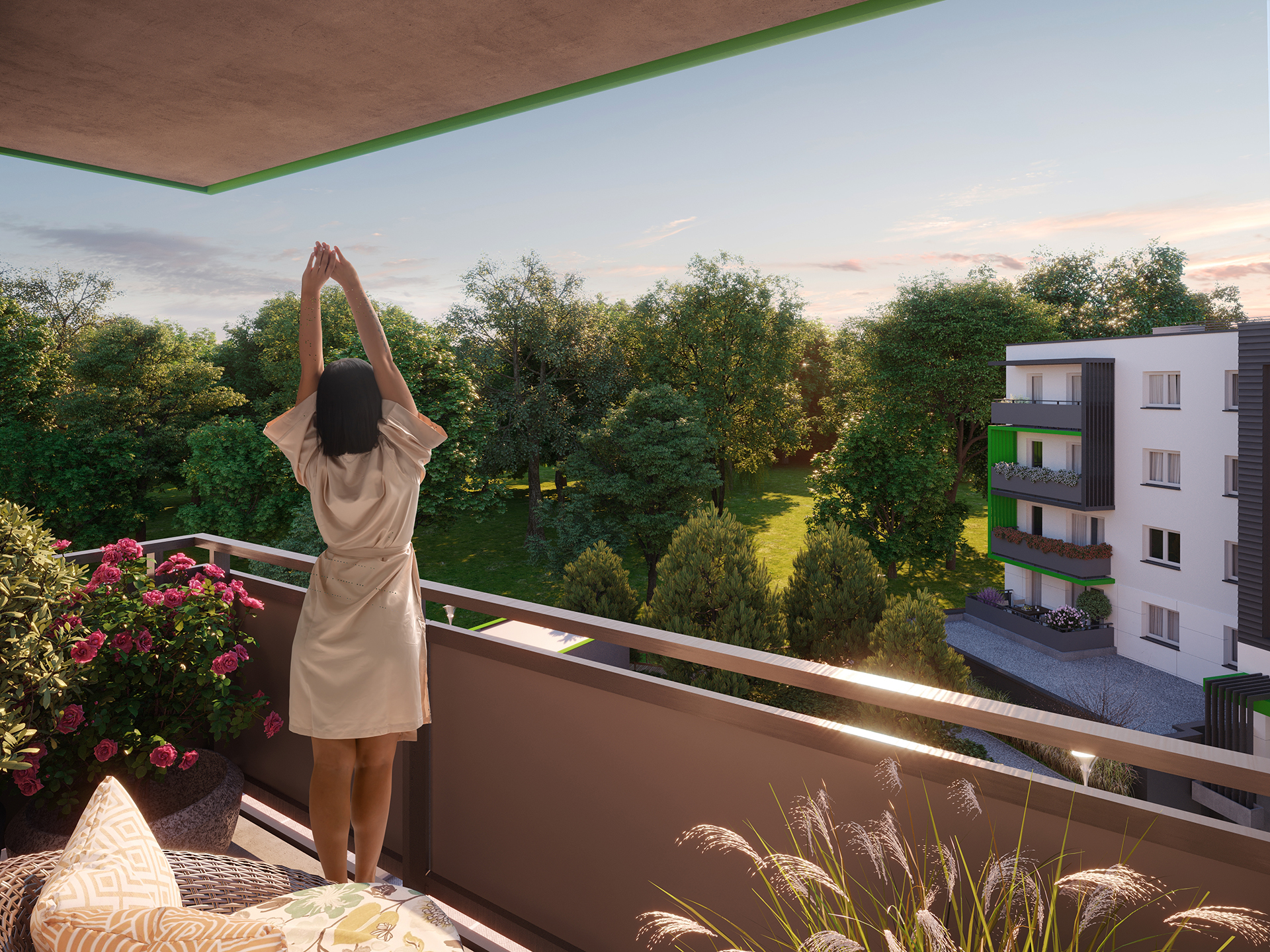 Kobieta przeciąga się o poranku, na balkonie w osiedlu Olimpia Port